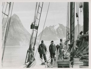 Image of Miriam and other standing forward and looking at glacier